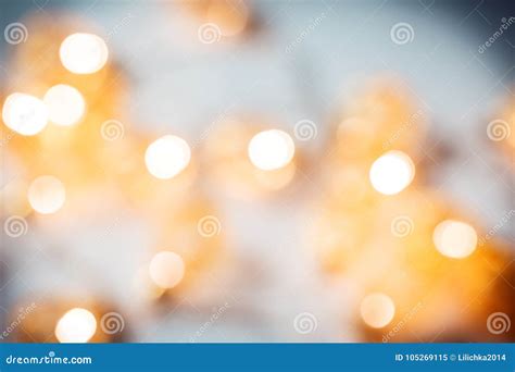 Christmas Blurred Background With A Glowing Garland Golden Bokeh On