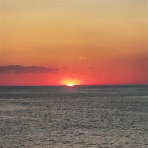 Red Sun Sets Over Ocean Photograph By Vic Ritchey Fine Art America