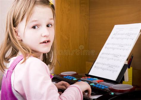 Little Girl Playing At Piano Stock Photography Image 14183362