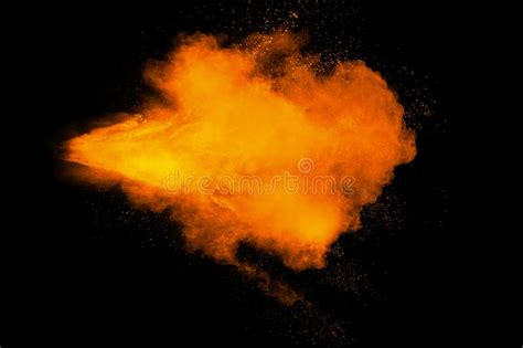 Abstract Yellow Orange Powder Explosion On Black Background Freeze
