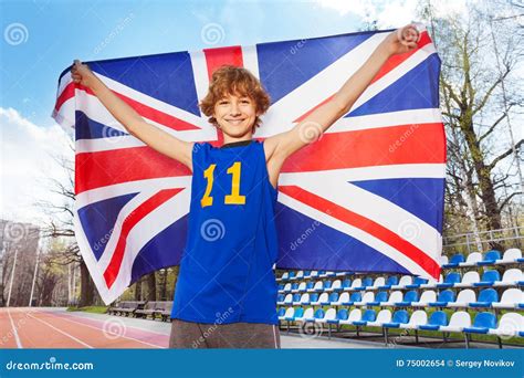Smiling Teenage Boy With British Flag On A Stadium Stock Photo Image