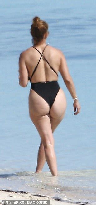 jennifer lopez flaunts her famous derriere in a very cheeky one piece best world news
