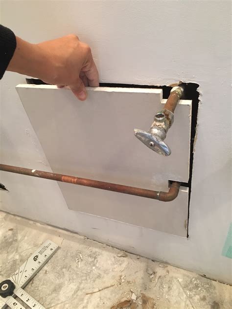 If any pipes extend out farther than the thickness of the drywall you are hanging, you have to cut a hole for the pipe in the drywall sheet. Don't Hire a Handyman: How to Fix Big Holes in Drywall