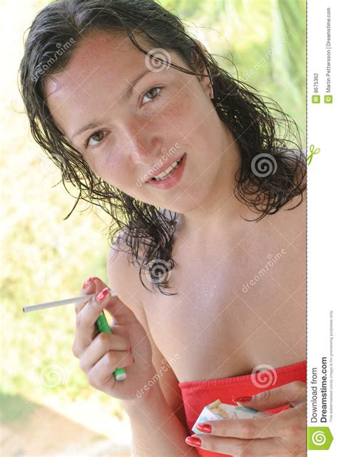 Beautiful Young Woman Smoking Cigarette Stock Photography
