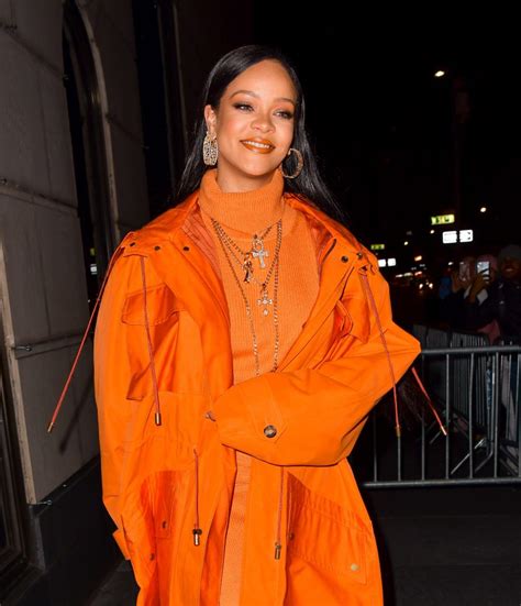 Rihanna Wore A 1660 Neon Coat And Matching Orange Dress To Celebrate