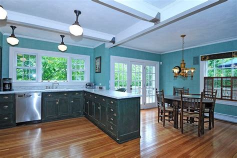 Light Blue Walls In A Kitchen With Brown Cabinets Josephgeach