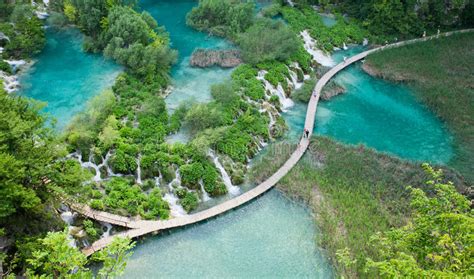Top View Of Plitvice Lakes With Waterfalls And Wooden