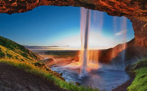 обои Солнечный лучик пейзаж водопад закат солнца море камень
