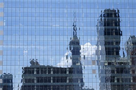 Reflections Of City Buildings In A Glass Skyscraper Stockfreedom