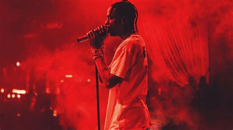 Travis Scott In Red Background Wearing White T Shirt Holding Mike Hd