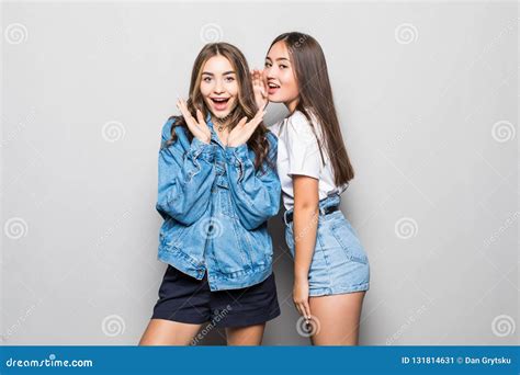 Portrait Of A Two Girls Gossip On Gray Background Stock Image Image Of Background Emotion