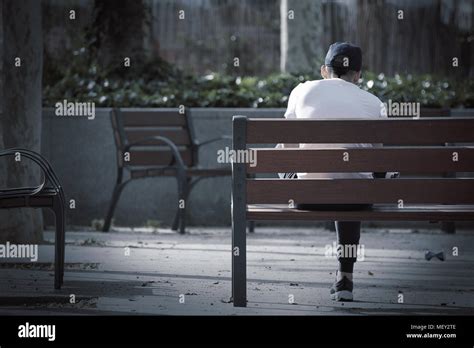 Depressed Man Sitting On Park Bench Hi Res Stock Photography And Images