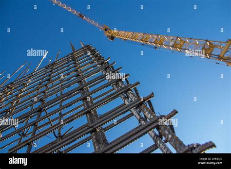 A Reinforced Steel Rebar Foundation Work And Tower Crane Against The