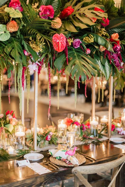tropical garden wedding centerpiece with palm leaves and fronds wood farm table… garden wedding