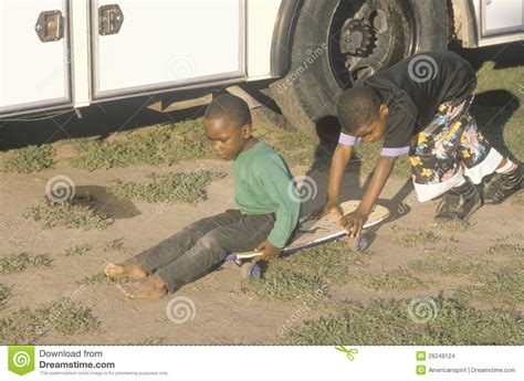 Two African American Boys Playing With A Skateboar Editorial Stock