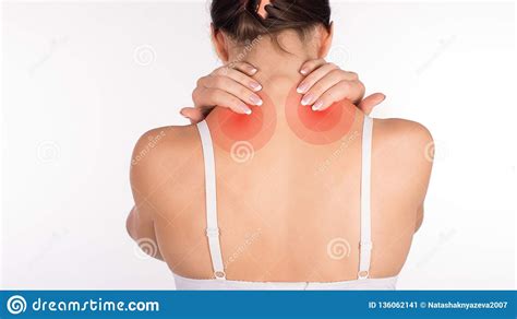 Woman With Neck And Shoulder Pain And Injury Back View Close Up