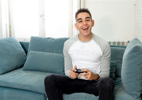 Close Up Portrait Of Young Man Playing Video Game Having Fun In Video