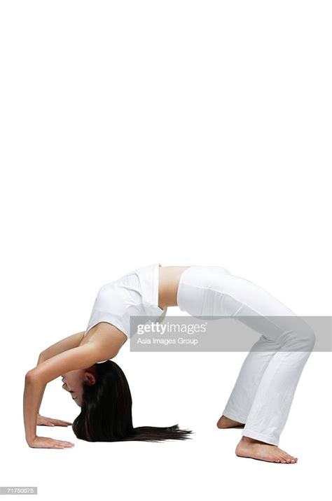 Woman Doing Yoga Bending Over Backwards High Res Stock Photo Getty Images