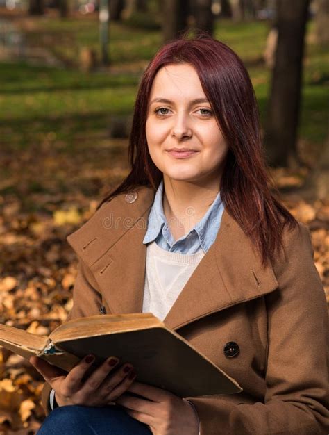 Redhead Girl Sitting On Bench In Park And Reading Book Stock Image Image Of Fashion Golden