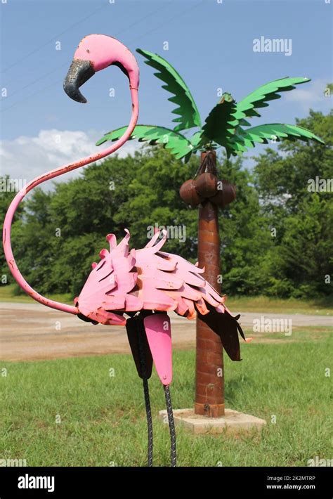 Pink Flamingo And Palm Tree Garden Ornaments Stock Photo Alamy