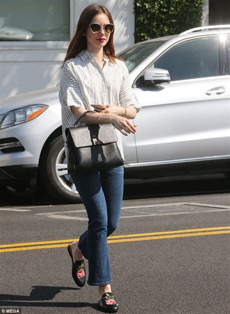 lily collins dons flared jeans and striped button up in beverly hills lily collins casual