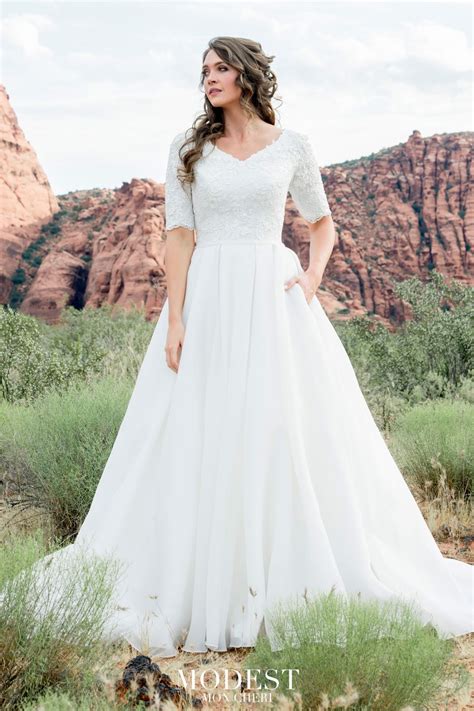 This Modest Bridal By Mon Cheri Tr12025 A Line Bridal Gown Features A Modest Wedding Dresses