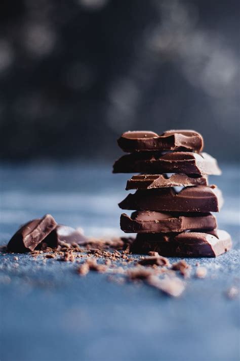 A Stack Of Chocolate Pieces Sitting On Top Of Each Other