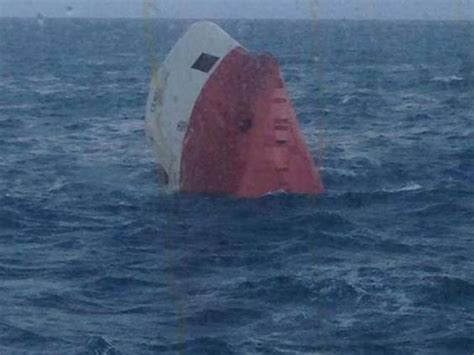 rescue teams search for crew of overturned cargo ship cemfjord off north coast of scotland the