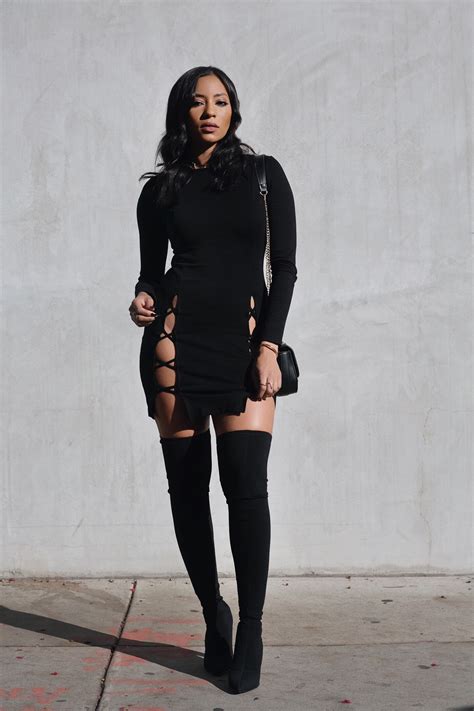 black dress with black thigh high boots
