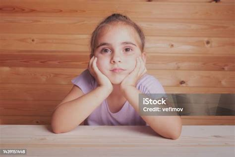 Sad Little Girl Thoughtful Sit Propping Up Face With Her Hands Stock