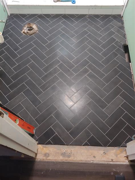 bathroom floor tile herringbone pattern herringbone vs chevron tile patterns how are they