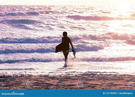 Surfer Man At The Beach At Sunset Stock Image Image Of Surfboard