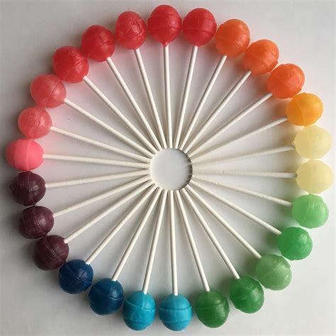 Brightly Hued Candies And Other Objects Arranged By Color To Create