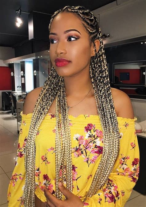 The middle part ensures that her hair falls evenly around her face which looks stunning! Two-Tone Cornrows | Hair styles, Braids for black women ...