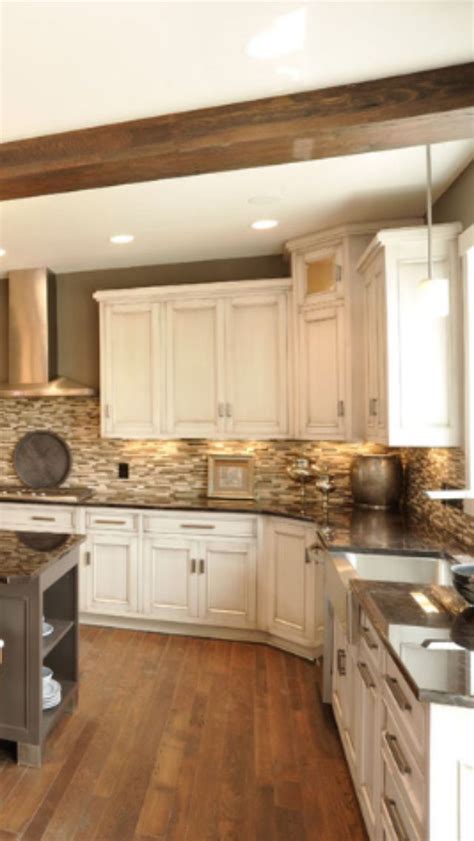 Cream is a more traditional option, offering a softness and warmth that will make your kitchen truly feel like the heart of the home. Our kitchen would look similar with the painted cabinets ...