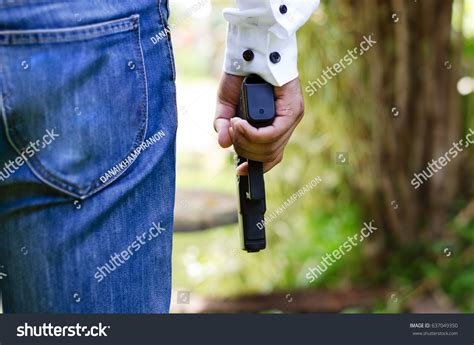 Mens Hands Holding Guns Stock Photo Edit Now 637049350