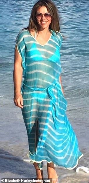 Elizabeth Hurley Flaunts Her Ample Cleavage In Tiny String Bikini