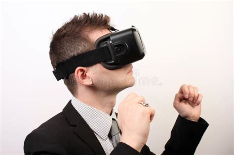 side view of a man wearing a vr virtual reality oculus rift 3d headset touching something with