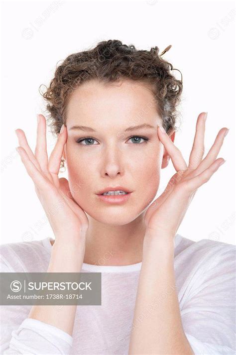 Portrait Of A Woman Rubbing Temples Superstock