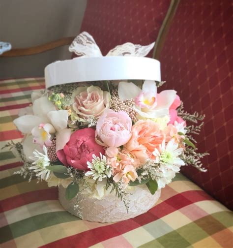 Hatbox flower compositions are a new and fashionable way to compliment someone. Lace Hat Box Arrangement | Hat box flowers, Home floral ...