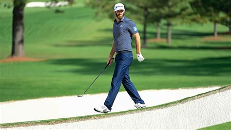 Dustin Johnson Examines The Green At No 7 During Sundays Final Round