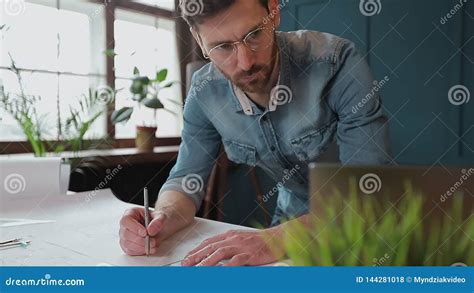 Architect Working On Blueprint With Spesial Tools And Pencil Close Up