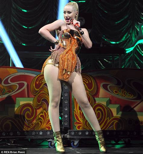 Katy Perry Wears Tartan Mini Skirt And Fishnets As She Closes Itunes