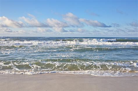 Ocean Waves Crash Upon The Sandy Beach Stock Photo Image Of Ocean