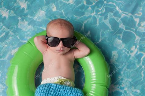 Newborn Baby Boy Floating On An Inflatable Swim Ring Stock Photo By