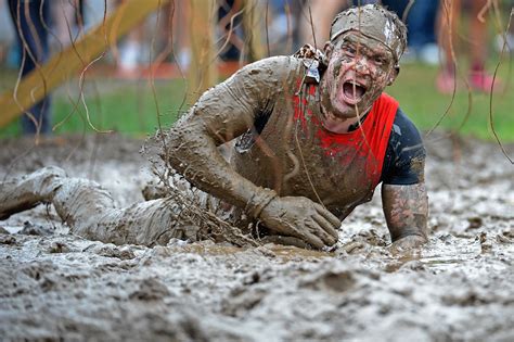 thousands set to run swing and crawl through scotland s annual tough mudder challenge the