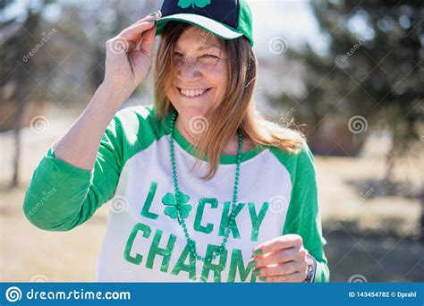 Woman Laughing And Celebrating St Pattys Day Outside In Sunlight Stock