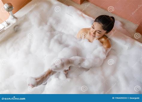 Woman Relaxing And Takes Bubble Bath In Bathtub With Foam Stock Image Image Of Bathroom
