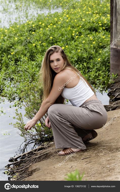 Caucasian Teen Girl Squatting On River Bank Stock Photo By Jeffwqc