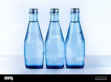 Perfectly Refreshing Studio Shot Of Three Glass Water Bottles Stock